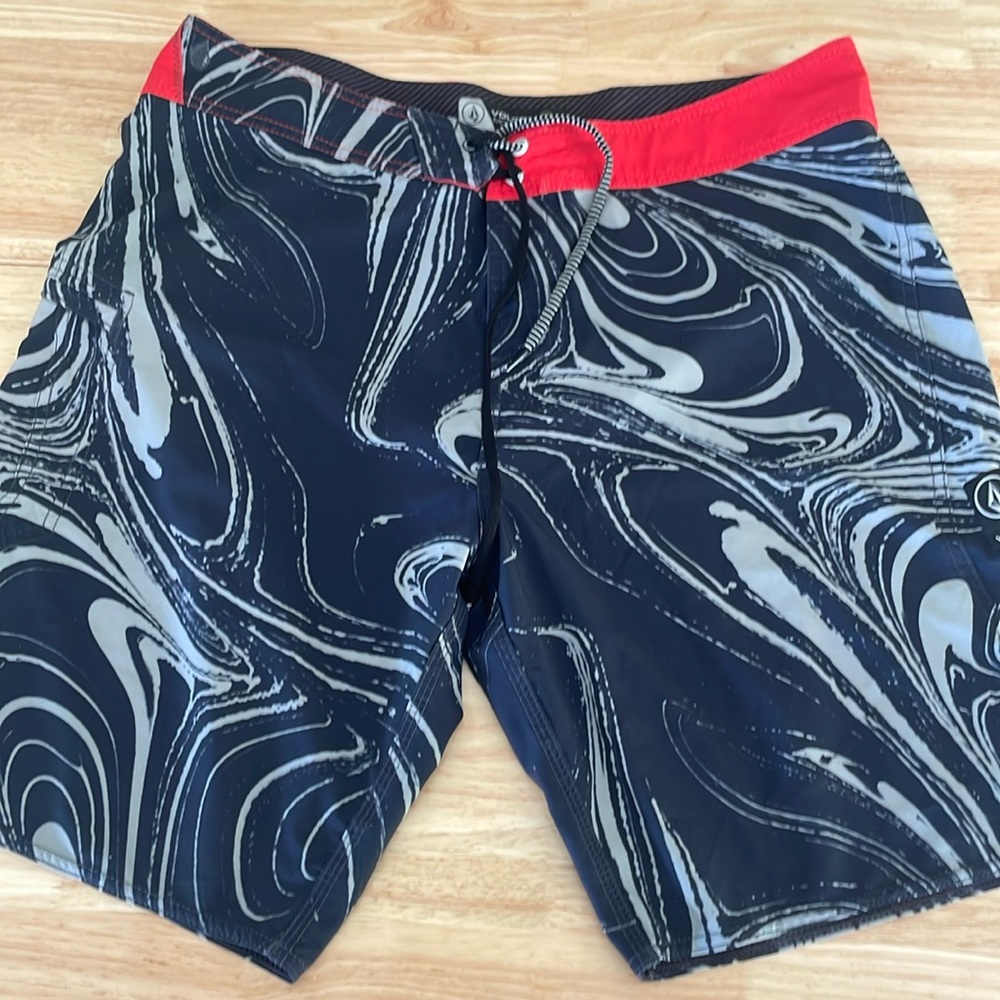 Volcom board shorts size  36 blue white swirl red waist.